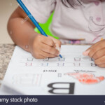 Child Tracing Hand Stock Photos &amp; Child Tracing Hand Stock in Tracing Letters With Fingers